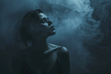 Fototapeta premium Creative concept portrait photography against a moody gradient background transitioning from deep indigo to charcoal gray.