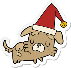 sticker of a cartoon dog in christmas hat