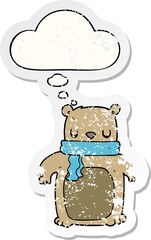 cartoon bear with scarf and thought bubble as a distressed worn sticker