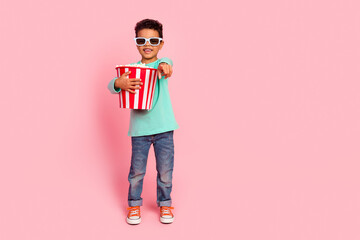 Full size photo of charming small boy watch movie finger point you wear trendy aquamarine outfit isolated on pink color background