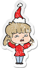 distressed sticker cartoon of a worried woman wearing santa hat