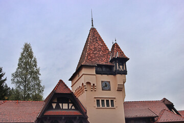 Fototapeta premium Entrance to the Peles castle, with tradition Romanian houses in Sinaia, Romania