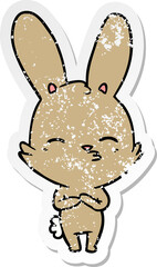 distressed sticker of a curious bunny cartoon