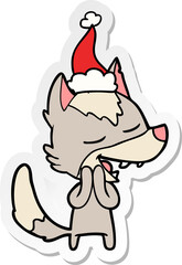 sticker cartoon of a wolf laughing wearing santa hat