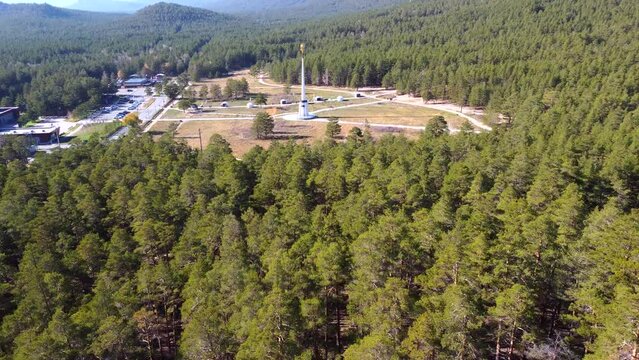 Aerial drone footage to the stunning nature of Borovoe, majestic cliffs with a pine forest, among which is the high stele of Ablai Khan. An atmospheric journey through Kazakhstan.
