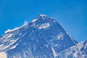 Mount Everest gigantic West Face close up along with summit and south summit in this long range photo taken from the top of Gokyo ri in Nepal