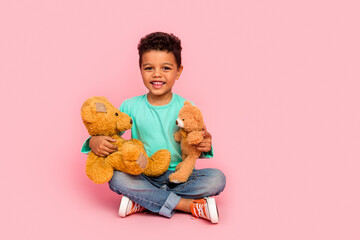 Full body photo of cute little boy sit floor play two teddy bears wear trendy aquamarine clothes...