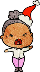 Naklejka premium textured cartoon of a angry old woman wearing santa hat