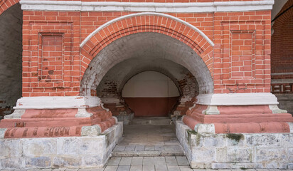 beautiful arch made of red and white bricks