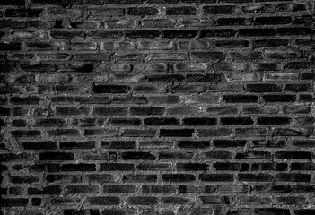 Brick wall with grout cement illuminated by a grey light in Brazil