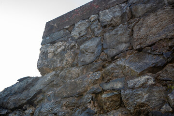 Old wall with wet rocks