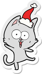 funny sticker cartoon of a cat wearing santa hat
