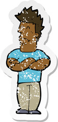 retro distressed sticker of a cartoon sulking man