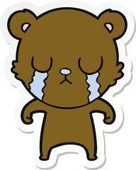 sticker of a crying cartoon bear