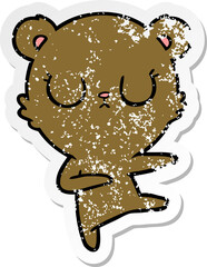 distressed sticker of a peaceful cartoon bear cub