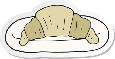 sticker of a cartoon croissant