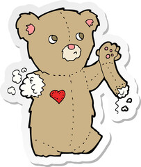 sticker of a cartoon teddy bear with torn arm