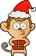 textured cartoon of a christmas monkey wearing santa hat