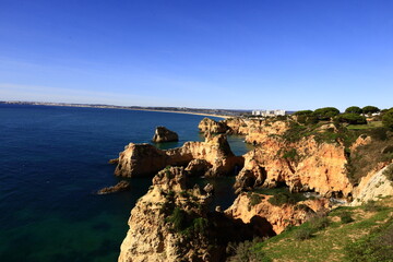 Fototapeta na wymiar Ponta da Piedade is a headland with a group of rock formations along the coastline of the town of Lagos, in the Portuguese region of the Algarve