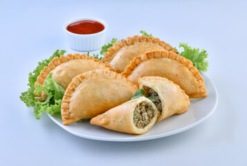 Delicious Half Circle Shape Samosa, stuffed with spicy chicken and herbs