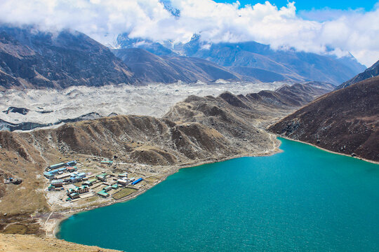Gokyo Tsho or Dudh Pokhari is an emerald green high altitude Himalayan lake at 4700 meters,listed as a Ramsar wetland on the shores of Gokyo bordering the vast Ngozumpa glacier in Nepal