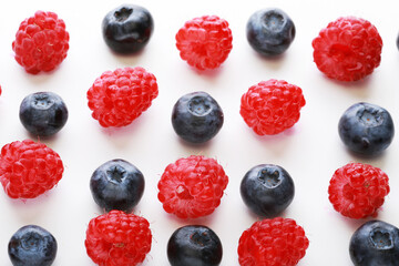 Various fresh berries isolated on white background. Raspberry and Blueberry