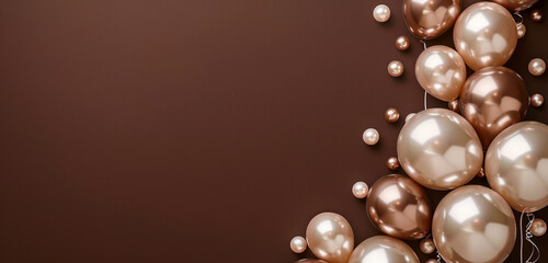 An elegant arrangement of pearl and champagne-colored balloons, floating against a rich chocolate...