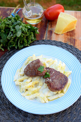 penne pasta with red bolognese sauce, typical Italian cuisine with filet mignon