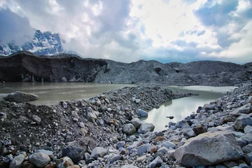 Foto auf Acrylglas Cho Oyu Melt pools inside the Ngozumpa Glacier, Nepal's largest glacier with massive debris, stone, ice and clay deposits flowing from Mount Cho Oyu and giving rise to the Dudh Kosi river in Nepal