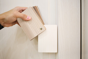 Mans hand with samples of decors for furniture