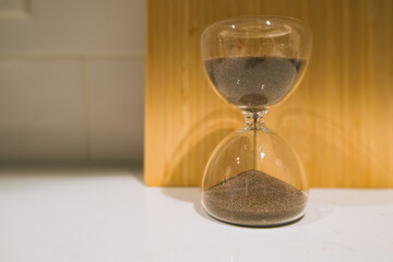 hourglass on sand, time is passing, deadline concept