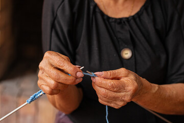 The knit of life. Elderly woman's artistic haven. A delightful elderly woman enjoys her retirement,...