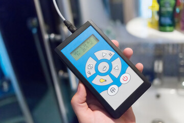 Closeup electronical anemometer  in the human hand