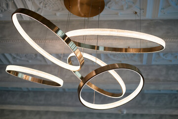 Chandelier on the concrete ceiling. Circles or rings. Luminaire design - 751620353