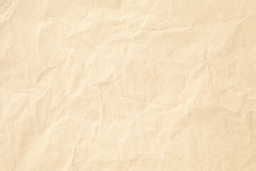 Brown crumpled paper texture with grains macro closeup