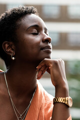Fototapeta na wymiar Portrait of black woman with peaceful gesture.