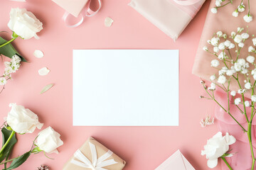 Fototapeta na wymiar Spring Blossoms Stationery Mockup: Pink and White Floral Arrangement on Elegant White Table Background for Greeting Cards, Invitations, and Gifts