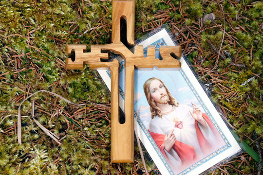 Wooden cross with the name of Jesus. Christian symbol.