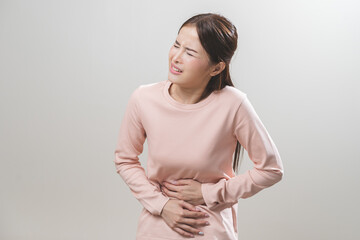 Flatulence asian young woman intolerance hand in stomach ache, suffer from food poisoning,...