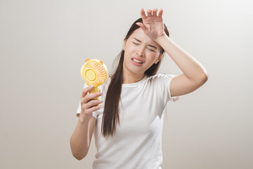 Suffering summer heat wave stroke, hot weather, tired asian young woman sweaty and thirsty,...