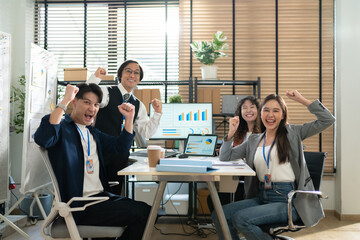 Portrait of Team of young Asian entrepreneurs and startup have business meeting and encouraging each other for good spirit energy to accomplish successful marketing plan.Marketing Analysis Team