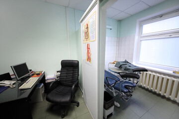  interior of exam room gastroenterologist with study poster about treatment of motor disorders of...