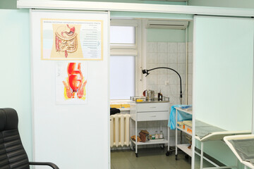 interior of exam room,with informational posters: treatment of motor disorders of digestive tract, riding laboratory stand in Center Endosurgery and Lithotripsy