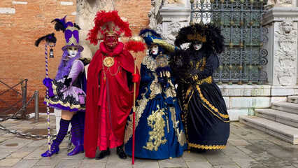 Naklejka premium Venice Carnival. People in Venetian carnival masks and costumes on streets of Venice, Italy, Europe February 10, 2024