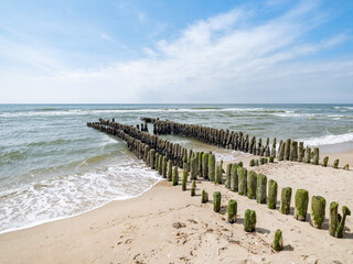 Groyne pillars at the coastline of Rantum, Sylt, Schleswig-Holstein, Germany