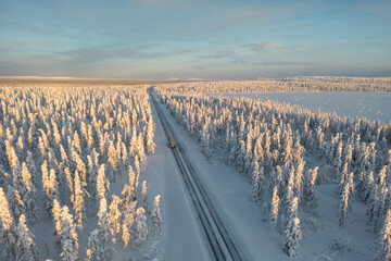 Aerial view of a snow-covered road in Finnish Lapland