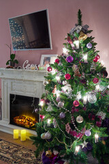 Fototapeta na wymiar Decorated Christmas firtree and fireplace in room