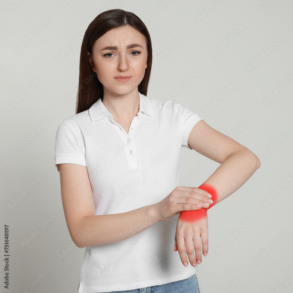 Sticker Woman suffering from rheumatism on light background