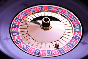 Roulette wheel with ball, closeup. Casino game