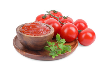 Organic ketchup in bowl, fresh tomatoes and parsley isolated on white. Tomato sauce